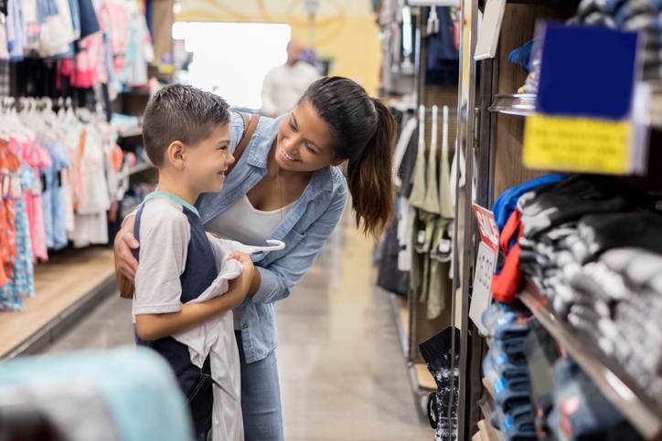 Mom shops for school clothes with her son Mom shops for school clothes with her son