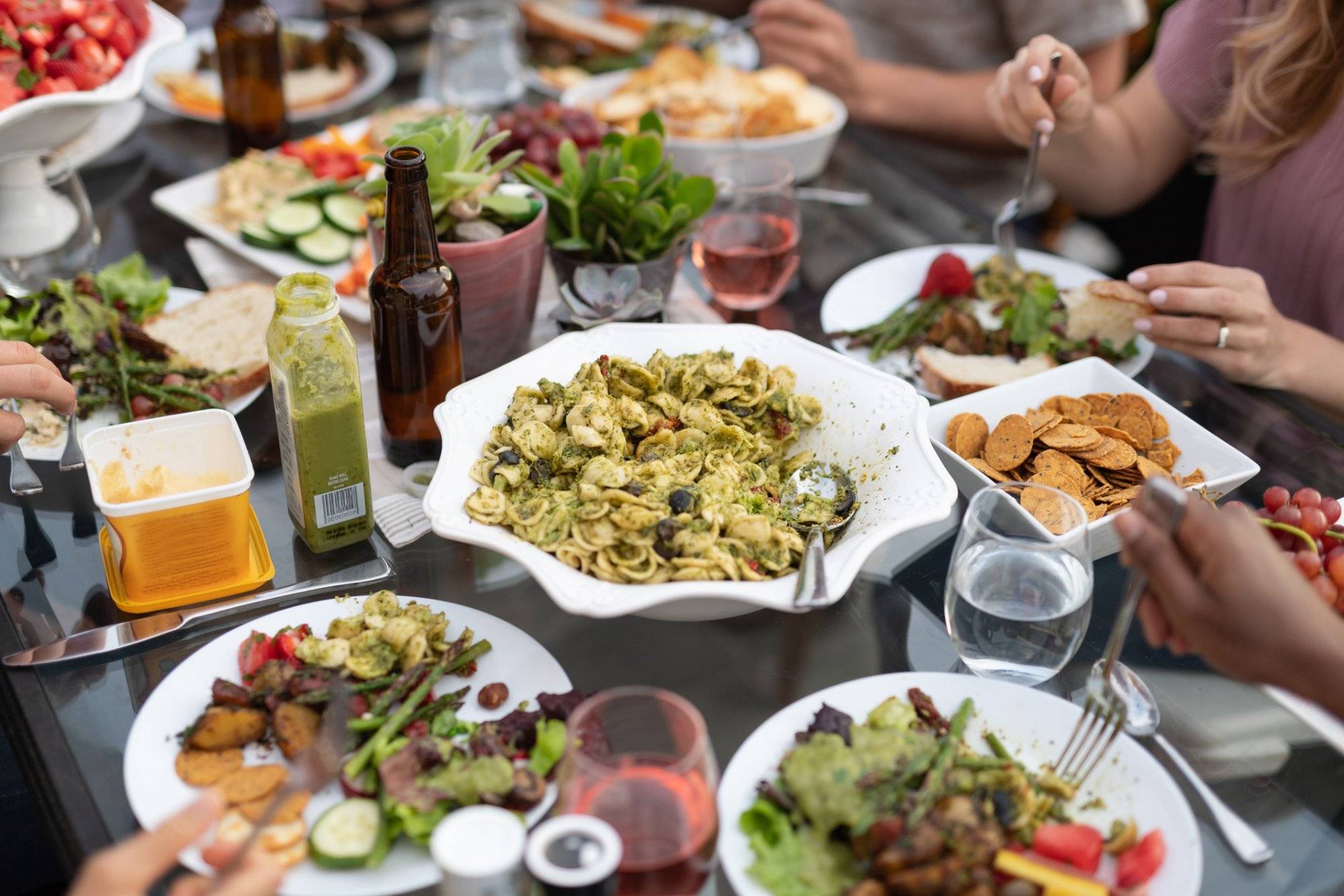 A group of young adult friends dining al fresco on a patio